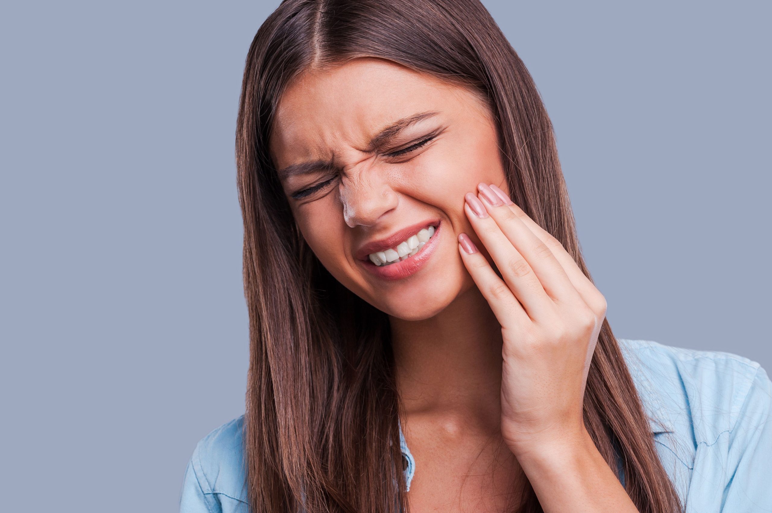 woman suffering oral pain from gum disease