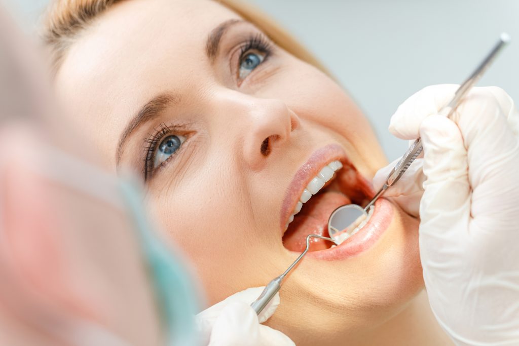 patient being checked for gum disease